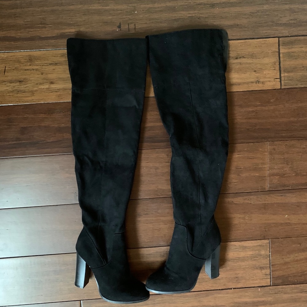 Black thigh high boots.